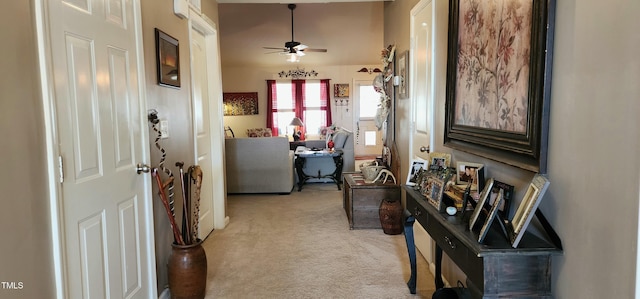 hall with light colored carpet