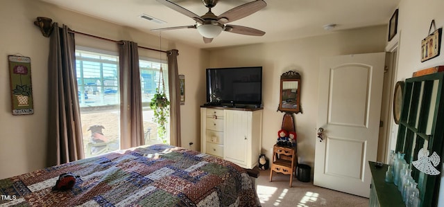 bedroom featuring light carpet and ceiling fan