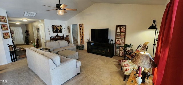 carpeted living room with ceiling fan and lofted ceiling