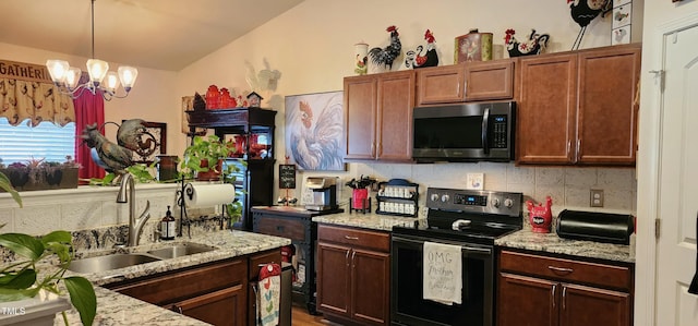 kitchen with electric stove, sink, backsplash, hanging light fixtures, and light stone countertops