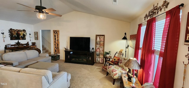 living room with lofted ceiling, light colored carpet, and ceiling fan