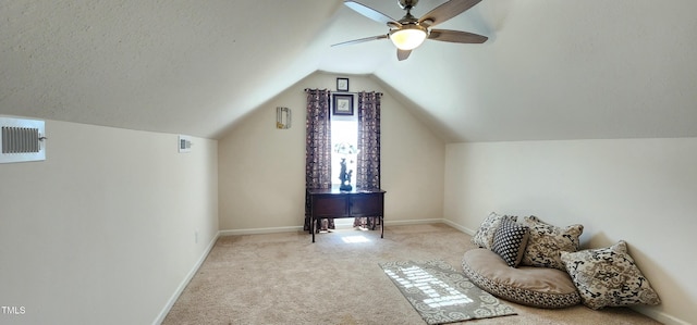 bonus room with light carpet, a textured ceiling, lofted ceiling, and ceiling fan