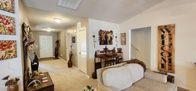 hall featuring light colored carpet and vaulted ceiling