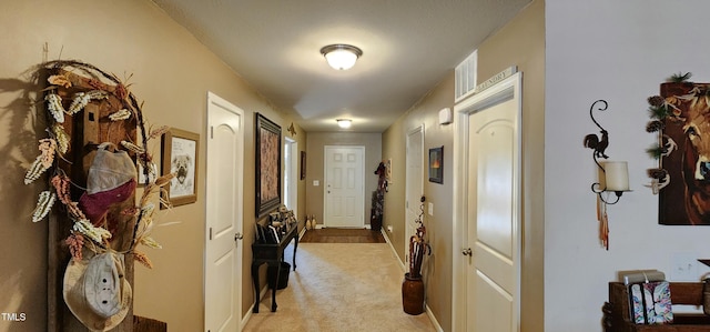 hallway with light carpet