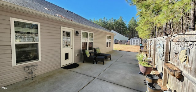 view of patio / terrace with a storage shed