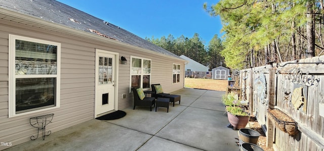 view of patio featuring a shed