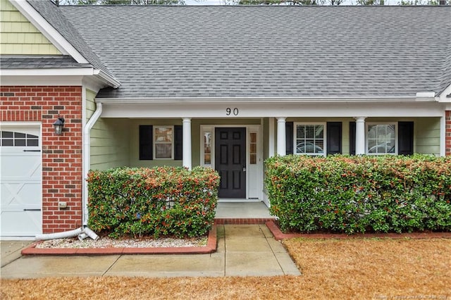 view of exterior entry with covered porch