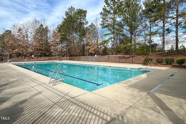 104 Mainline Station Dr, Durham, NC 27560 - community pool featuring a patio area and view of scattered trees