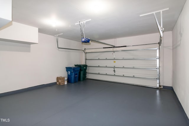 104 Mainline Station Dr, Durham, NC 27560 - garage featuring a garage door opener and baseboards