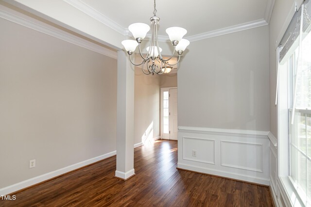 104 Mainline Station Dr, Durham, NC 27560 - unfurnished dining area with a chandelier, ornamental molding, and dark wood-style floors