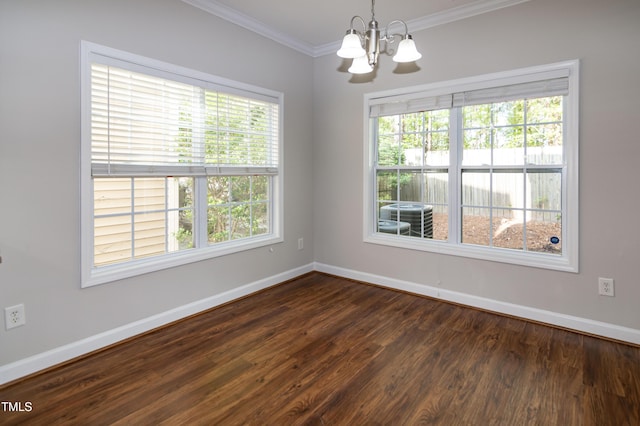 104 Mainline Station Dr, Durham, NC 27560 - empty room featuring a chandelier, ornamental molding, and dark wood-type flooring