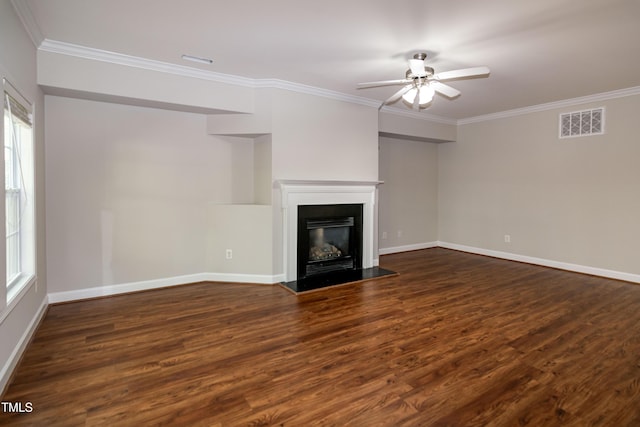 104 Mainline Station Dr, Durham, NC 27560 - unfurnished living room with wood finished floors, crown molding, a ceiling fan, a glass covered fireplace, and plenty of natural light