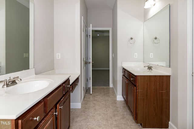 104 Mainline Station Dr, Durham, NC 27560 - bathroom featuring two vanities and tile patterned floors