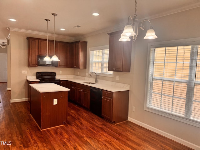 104 Mainline Station Dr, Durham, NC 27560 - kitchen featuring black appliances, a kitchen island, light countertops, dark wood finished floors, and crown molding