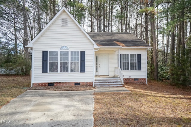 bungalow-style home featuring a front yard