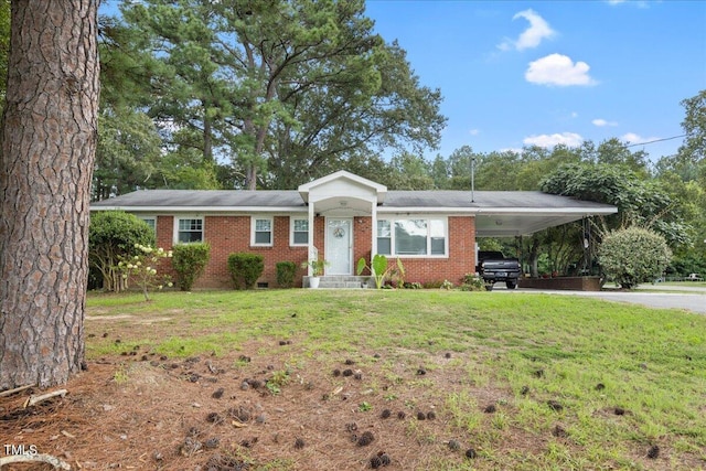 ranch-style house featuring a front yard and a carport