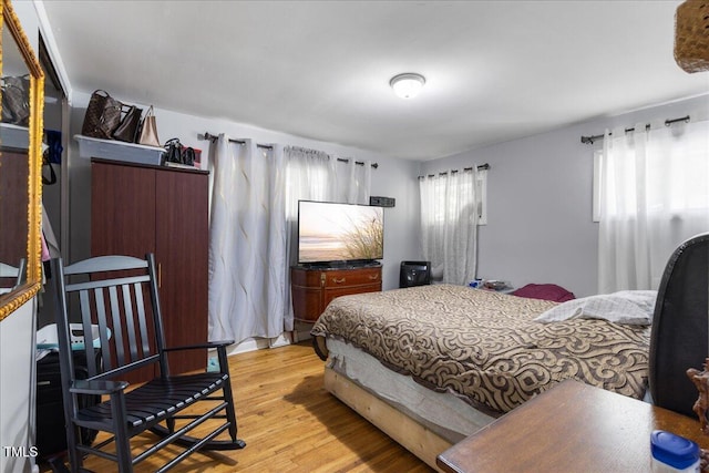 bedroom featuring light wood-type flooring