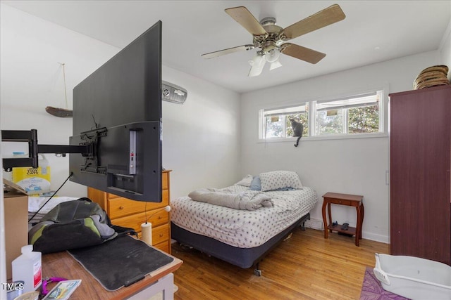 bedroom with ceiling fan and light wood-type flooring