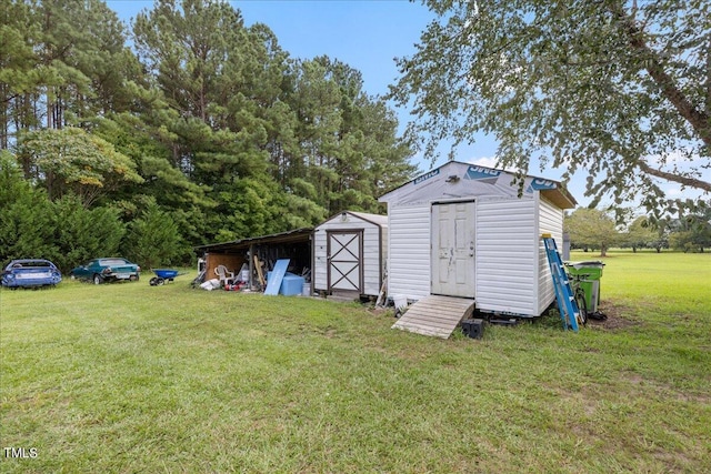 view of outbuilding featuring a yard