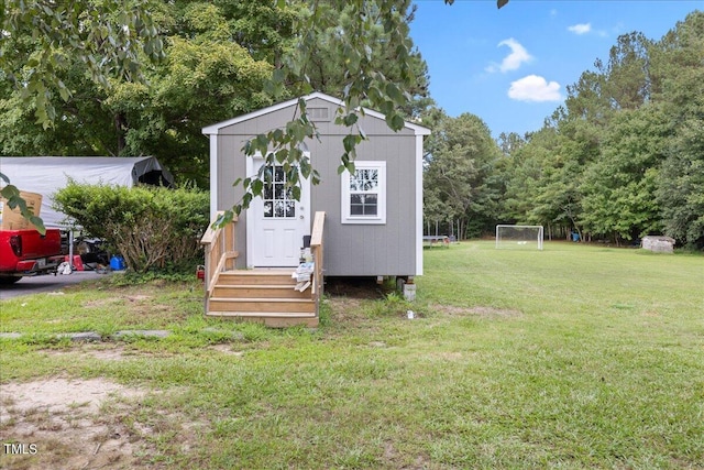 view of outdoor structure featuring a yard