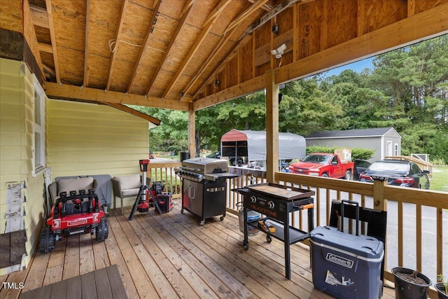 wooden terrace with a grill