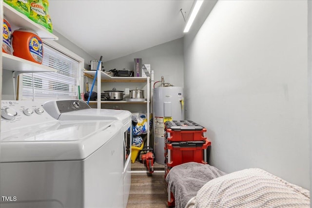 washroom featuring washer and dryer, electric water heater, and dark hardwood / wood-style floors