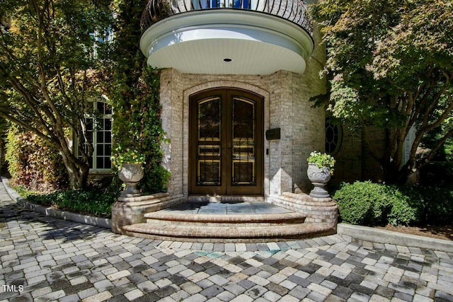 doorway to property featuring french doors and a balcony