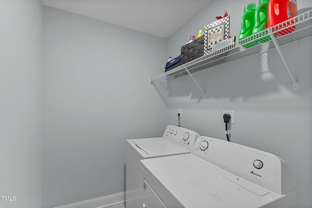 laundry room with washing machine and dryer