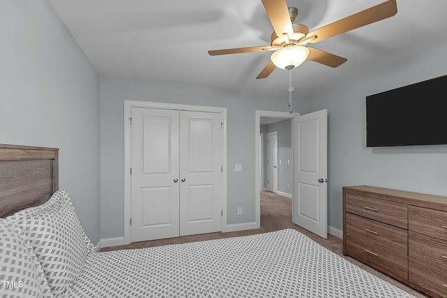 unfurnished bedroom featuring ceiling fan, carpet floors, and a closet