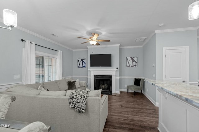 living room featuring crown molding, dark hardwood / wood-style floors, and ceiling fan