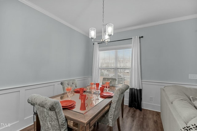 dining area featuring an inviting chandelier, dark hardwood / wood-style flooring, and ornamental molding