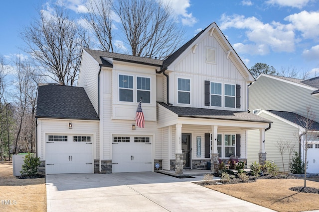 view of front of property with a porch, a shingled roof, board and batten siding, stone siding, and driveway