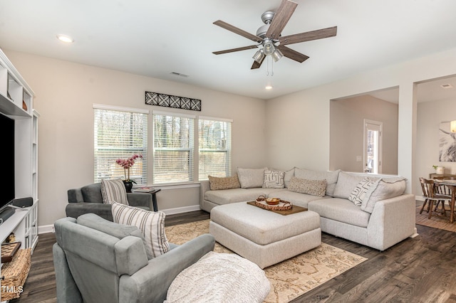 living area with a ceiling fan, recessed lighting, dark wood-style flooring, and baseboards