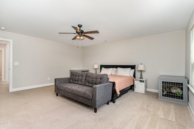 bedroom with baseboards, ceiling fan, and light colored carpet