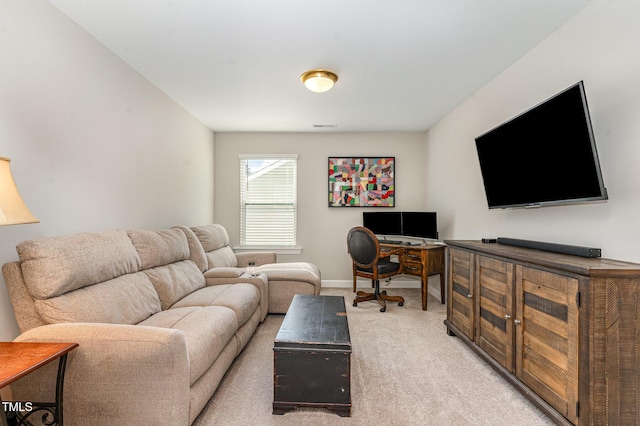 living area featuring light colored carpet, visible vents, and baseboards