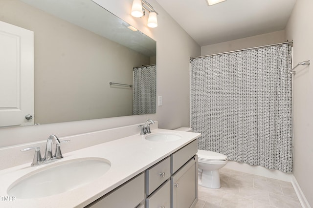 bathroom featuring tile patterned flooring, a sink, toilet, and double vanity