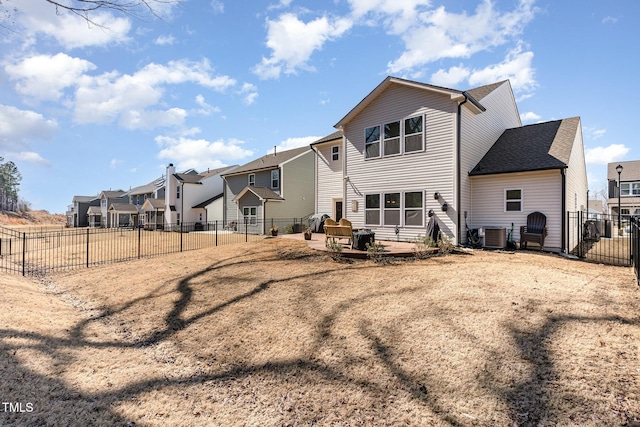 back of house with a residential view, a fenced backyard, a patio, and central air condition unit