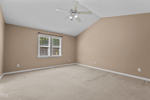 276 Sagamore Dr, Louisburg, NC 27549 - empty room with lofted ceiling, a ceiling fan, baseboards, and carpet flooring