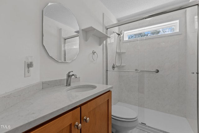 276 Sagamore Dr, Louisburg, NC 27549 - bathroom with a stall shower, vanity, toilet, and a textured ceiling