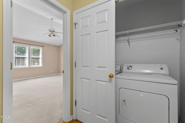276 Sagamore Dr, Louisburg, NC 27549 - clothes washing area with washer / clothes dryer, light carpet, ceiling fan, laundry area, and baseboards