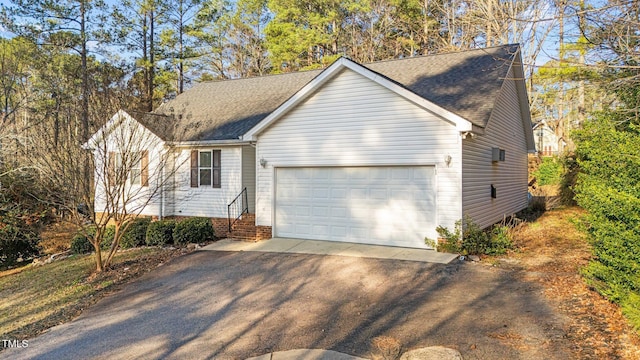 276 Sagamore Dr, Louisburg, NC 27549 - ranch-style house with a shingled roof, entry steps, an attached garage, and aphalt driveway