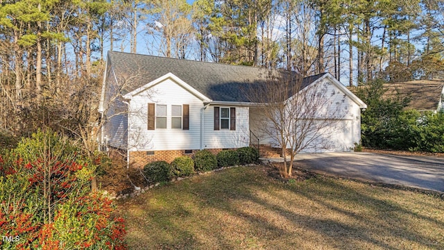276 Sagamore Dr, Louisburg, NC 27549 - ranch-style house featuring roof with shingles, a front yard, crawl space, a garage, and driveway