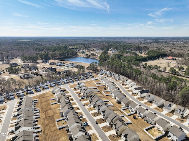 birds eye view of property with a water view and a residential view