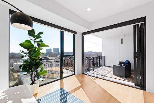 interior space featuring a view of city and wood finished floors