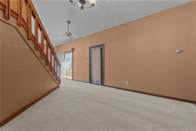 unfurnished living room with lofted ceiling, carpet flooring, and ceiling fan