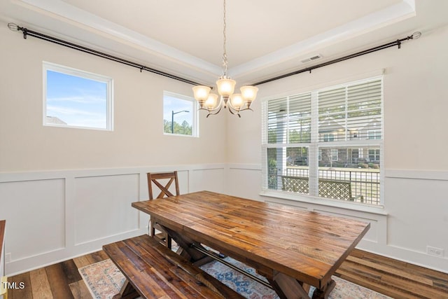 220 Green Haven Blvd, Youngsville, NC 27596 - dining space featuring dark wood-style flooring, visible vents, an inviting chandelier, and wainscoting