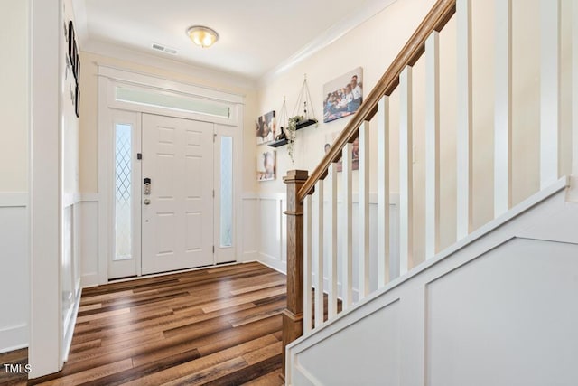 220 Green Haven Blvd, Youngsville, NC 27596 - foyer featuring stairs, wood finished floors, wainscoting, visible vents, and ornamental molding