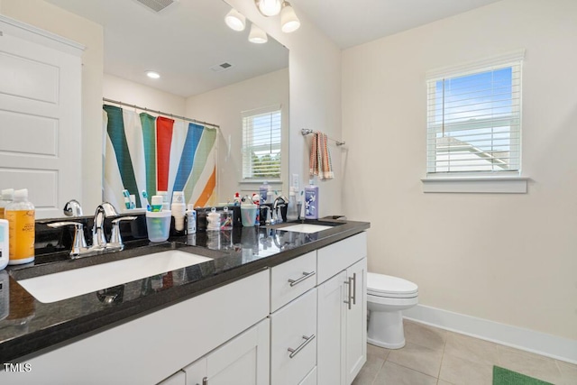 220 Green Haven Blvd, Youngsville, NC 27596 - full bath with toilet, a sink, tile patterned flooring, and visible vents