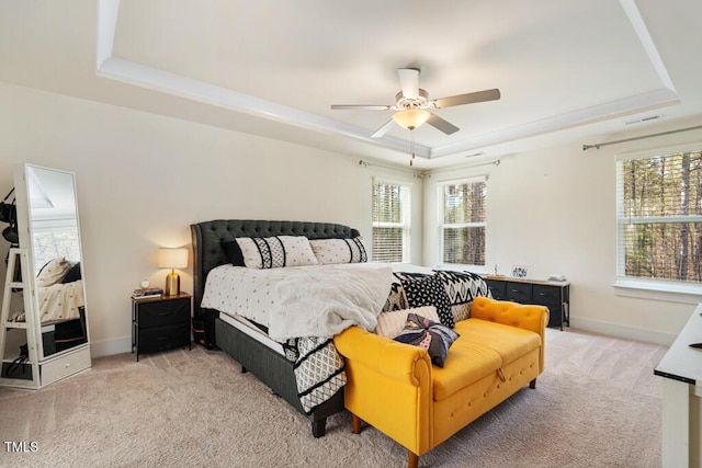 220 Green Haven Blvd, Youngsville, NC 27596 - bedroom featuring a raised ceiling, baseboards, light colored carpet, and visible vents