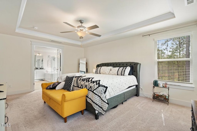 220 Green Haven Blvd, Youngsville, NC 27596 - carpeted bedroom with a raised ceiling, connected bathroom, baseboards, and visible vents